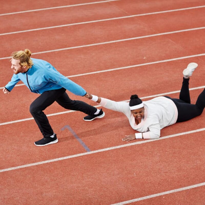 joe abbott motivation Determined personal trainer dragging exhausted overweight woman on track motivating her to keep running Determined personal trainer dragging exhausted overweight woman on track motivating her to keep running