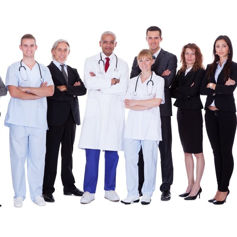 Hospital staff group A happy group photo depicting a group of staff people. Isolated on white